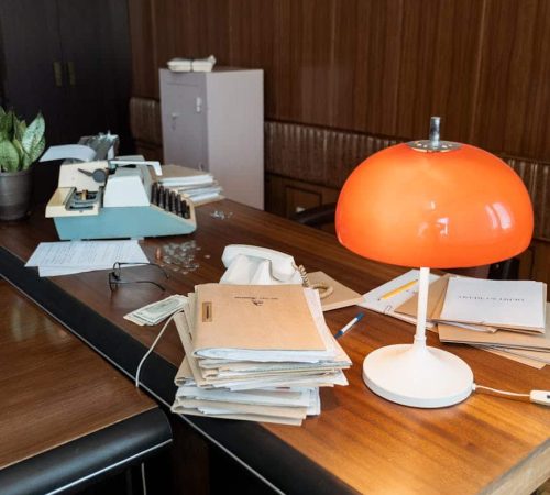 stacked of files on a desk